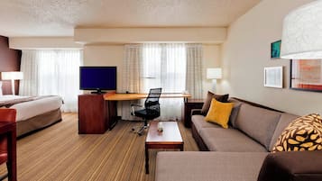 Premium bedding, desk, laptop workspace, blackout drapes