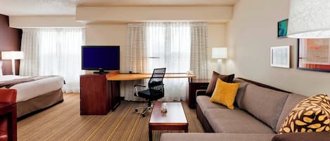 Premium bedding, desk, laptop workspace, blackout curtains