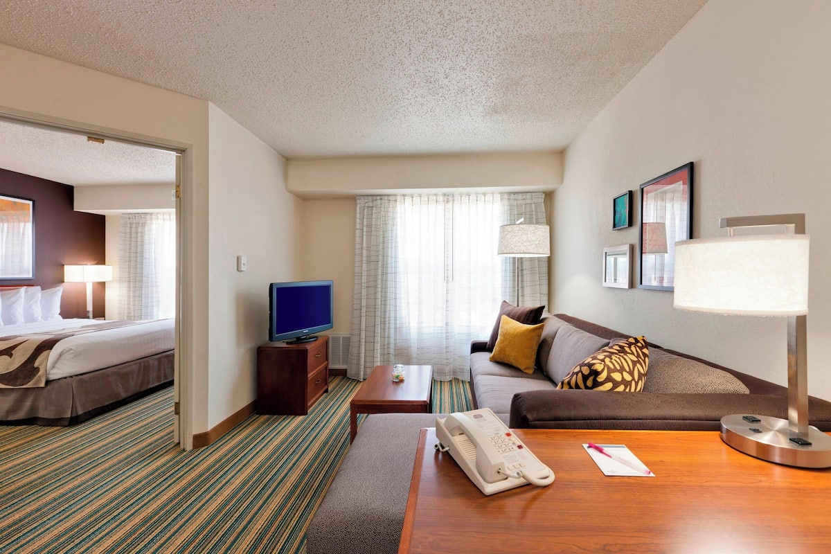 Premium bedding, desk, laptop workspace, blackout curtains