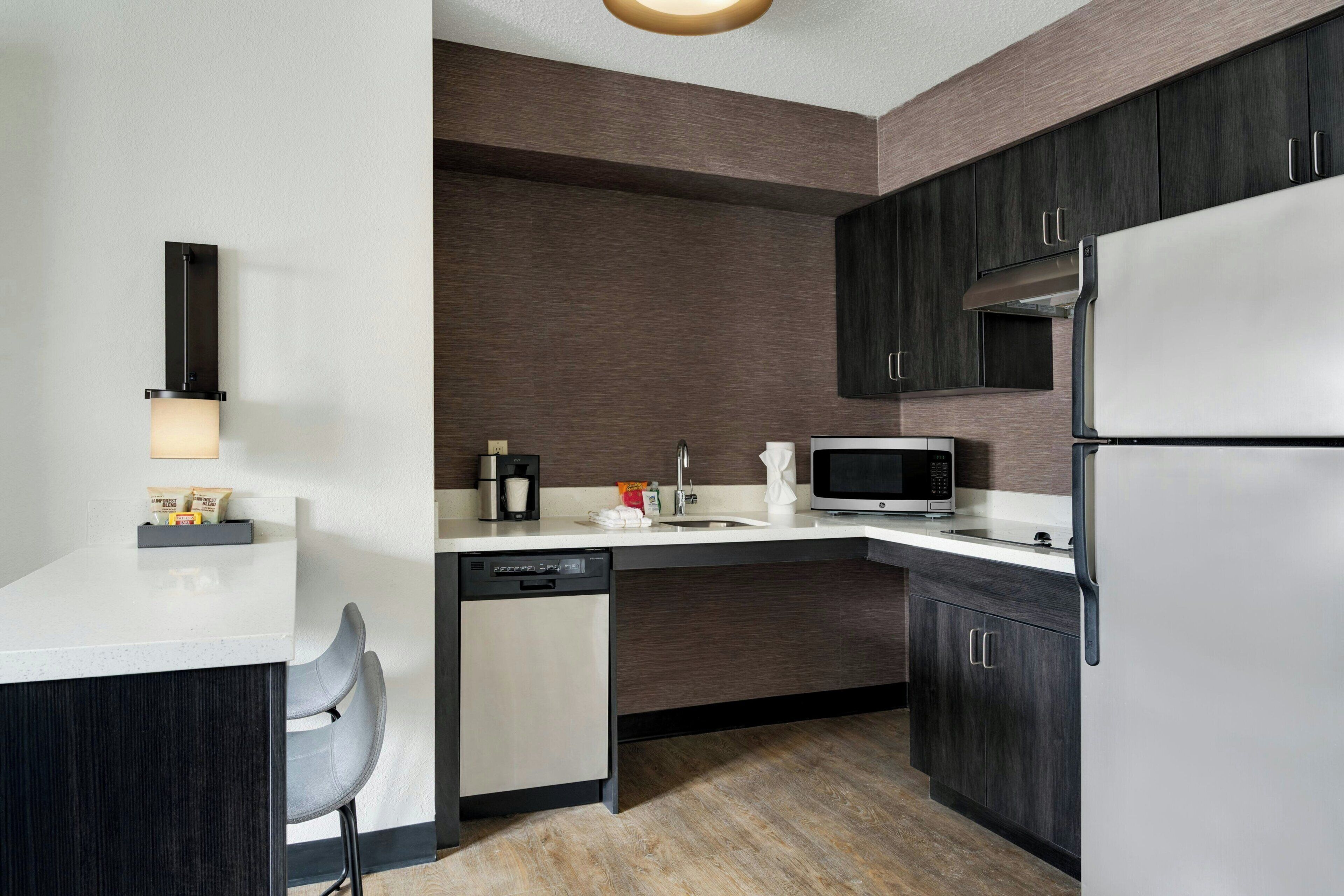 Full-sized fridge, microwave, stovetop, dishwasher