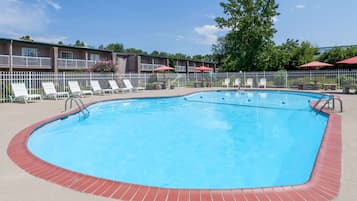 Seasonal outdoor pool, open 9:00 AM to 9:00 PM, pool loungers