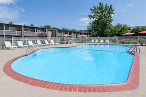 Seasonal outdoor pool, open 9:00 AM to 9:00 PM, pool loungers