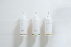Three bottles of Terra Green products on a white tiled wall. - Auburn Lodge Near University (Auburn)
