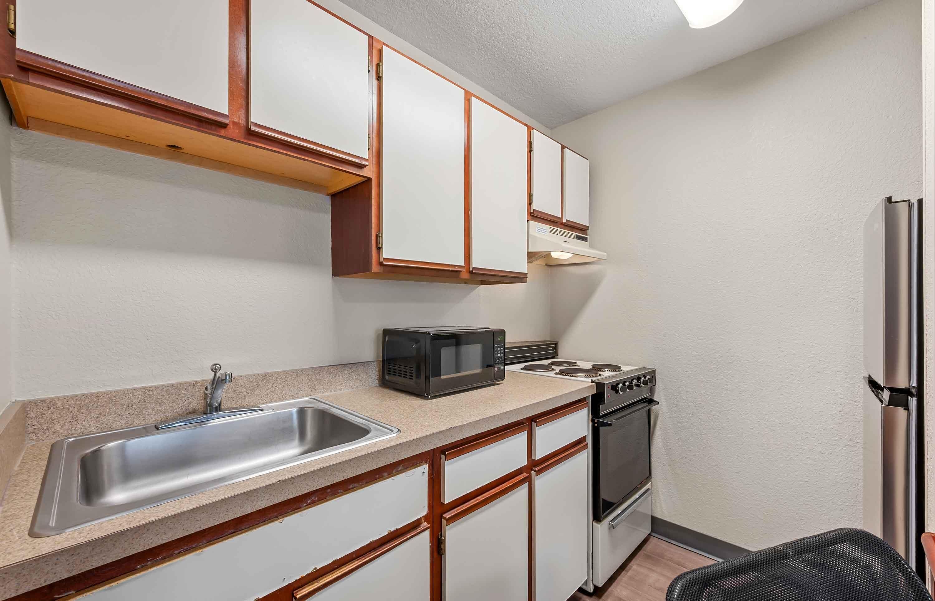 Studio, 1 Queen Bed, Non Smoking | Private kitchen | Fridge, microwave, stovetop, cookware/dishes/utensils