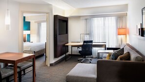 A hotel room with a bed, desk, office chair, and a sofa. - Residence Inn by Marriott Cincinnati Airport Erlanger (Erlanger)