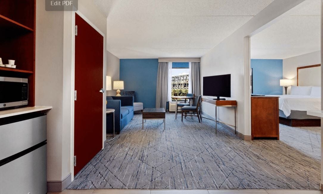 Suite, 1 King Bed, River View (Additional Living Area) | Premium bedding, down comforters, pillowtop beds, individually decorated