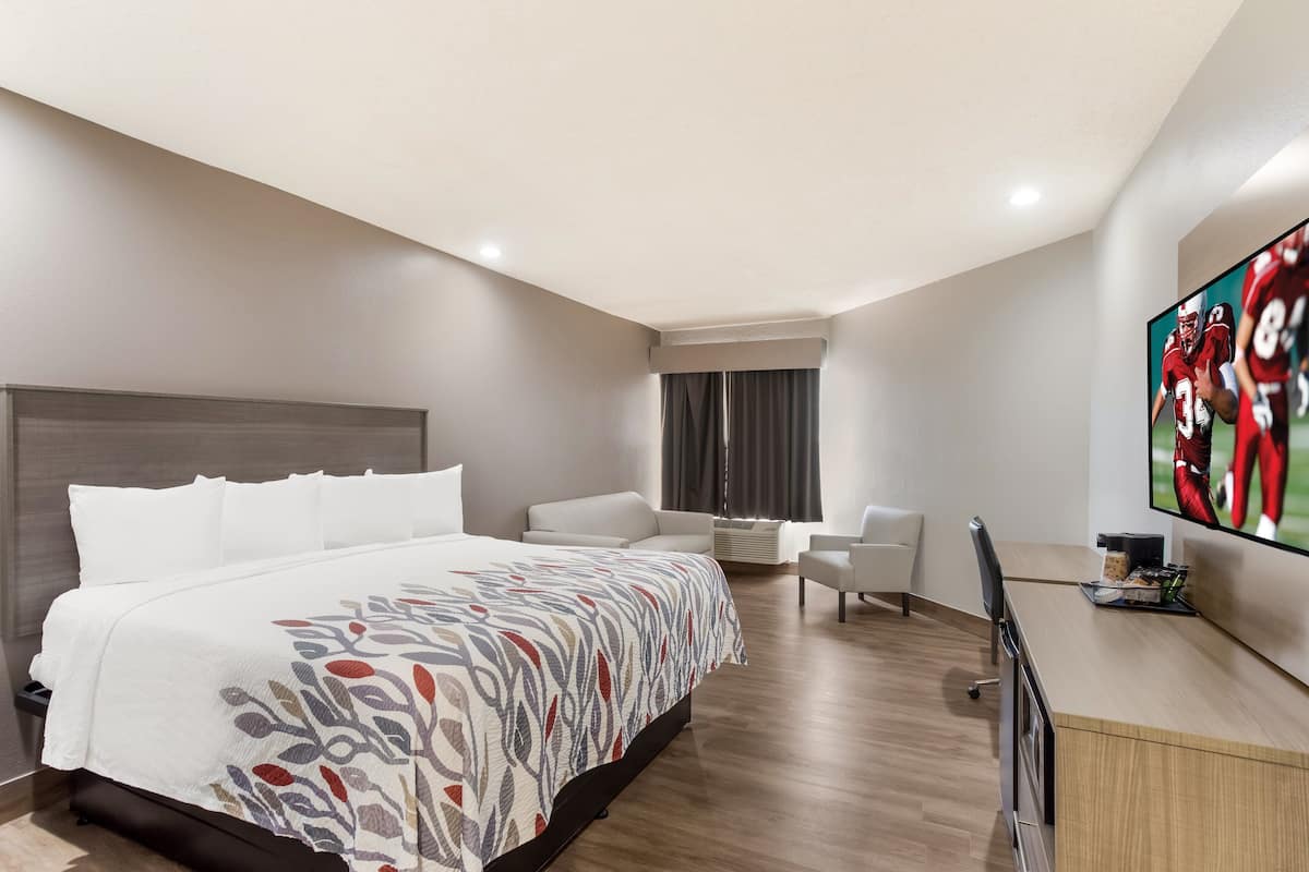 suite, 1 king bed, non smoking | desk, iron/ironing board, free cots/infant beds, rollaway beds