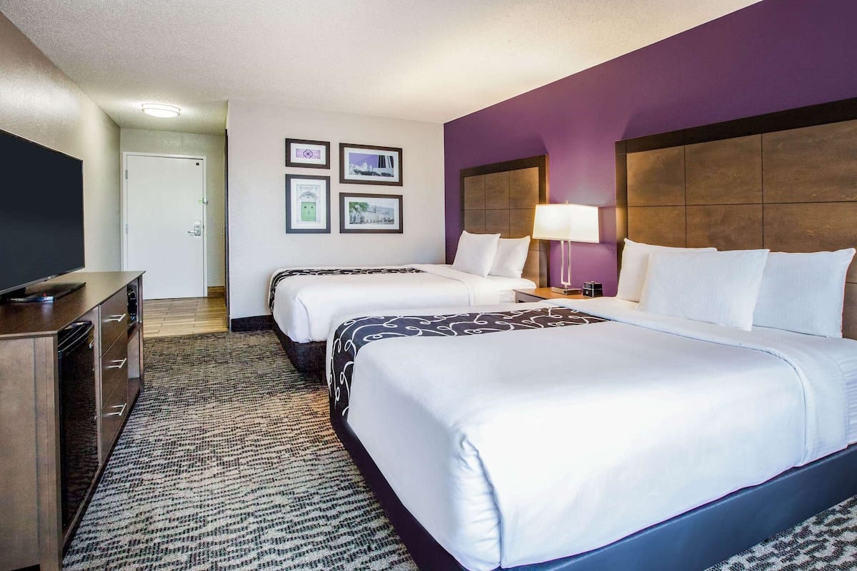 Room, 2 Queen Beds, Non Smoking | In-room safe, desk, iron/ironing board, free cribs/infant beds