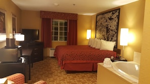 Suite, 1 King Bed, Jetted Tub | Premium bedding, desk, iron/ironing board, rollaway beds