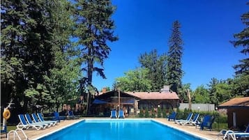 Seasonal outdoor pool, open 9:00 AM to 8:00 PM, pool umbrellas