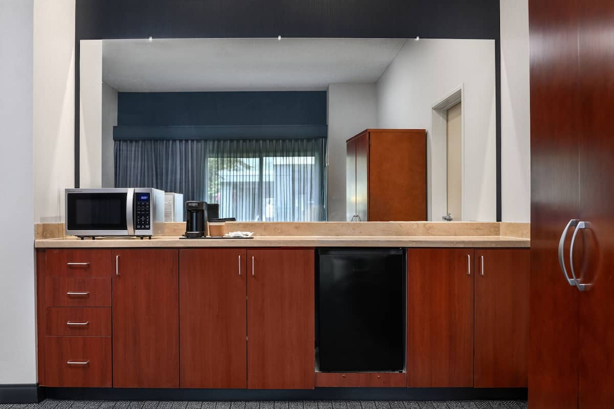 pillow-top beds, desk, laptop workspace, blackout curtains