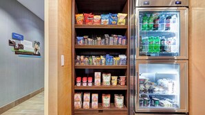 A snack and beverage vending machine with various snacks and drinks. - Fairfield Inn Tuscaloosa by Marriott (Tuscaloosa)