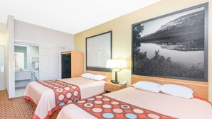 A hotel room with two beds, a bathroom, and a large framed picture of a lake. - Super 8 by Wyndham Wichita South (Wichita)