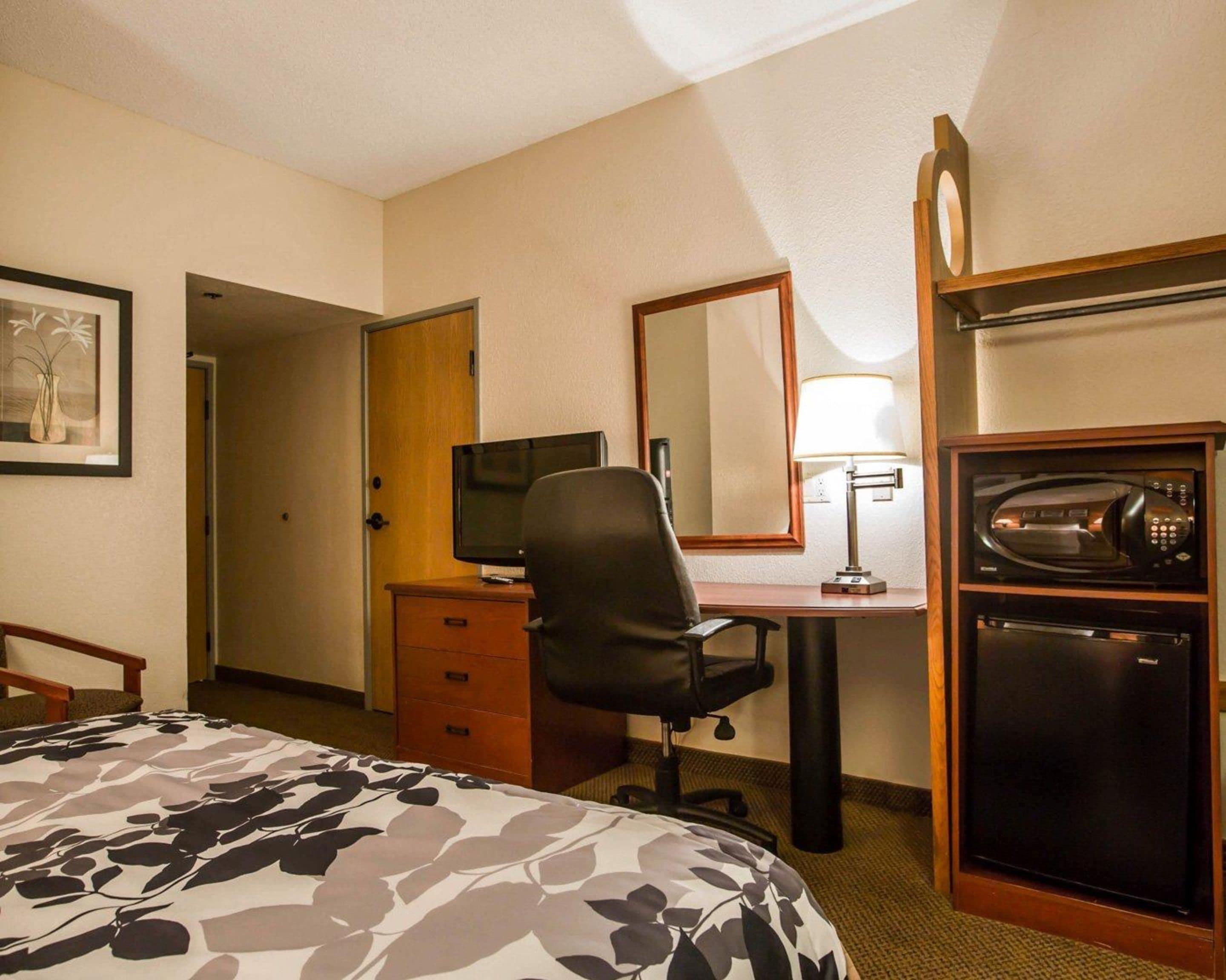 pillow-top beds, desk, laptop workspace, blackout curtains