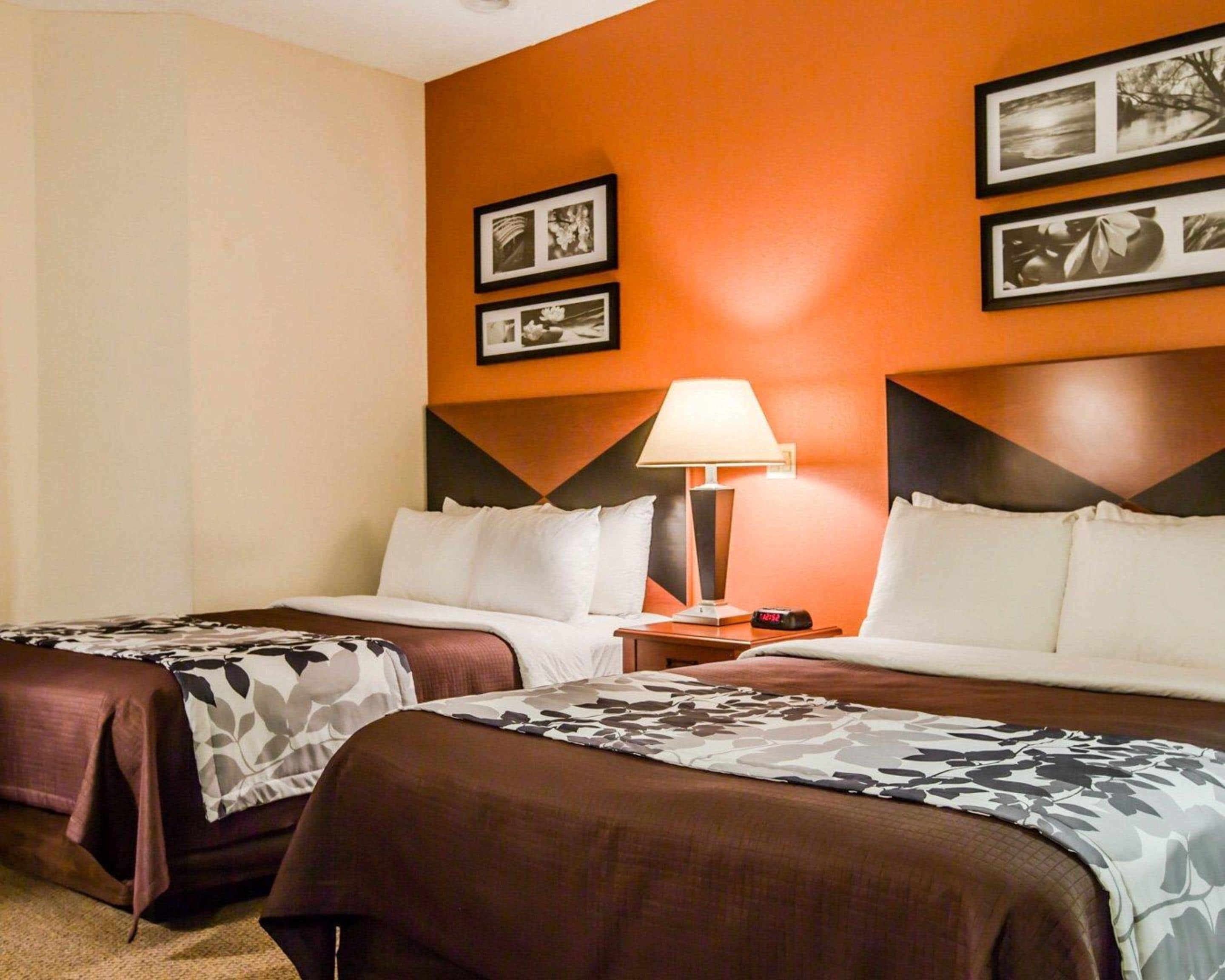 pillow-top beds, desk, laptop workspace, blackout curtains