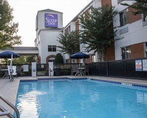 Seasonal outdoor pool, open 9:00 AM to 9:00 PM, pool umbrellas