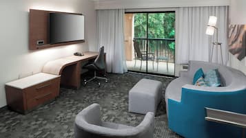 Suite, 1 King Bed with Sofa bed, Balcony | Living area | 32-inch flat-screen TV with cable channels, TV