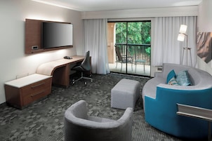 Suite, 1 King Bed with Sofa bed, Balcony | Living area
