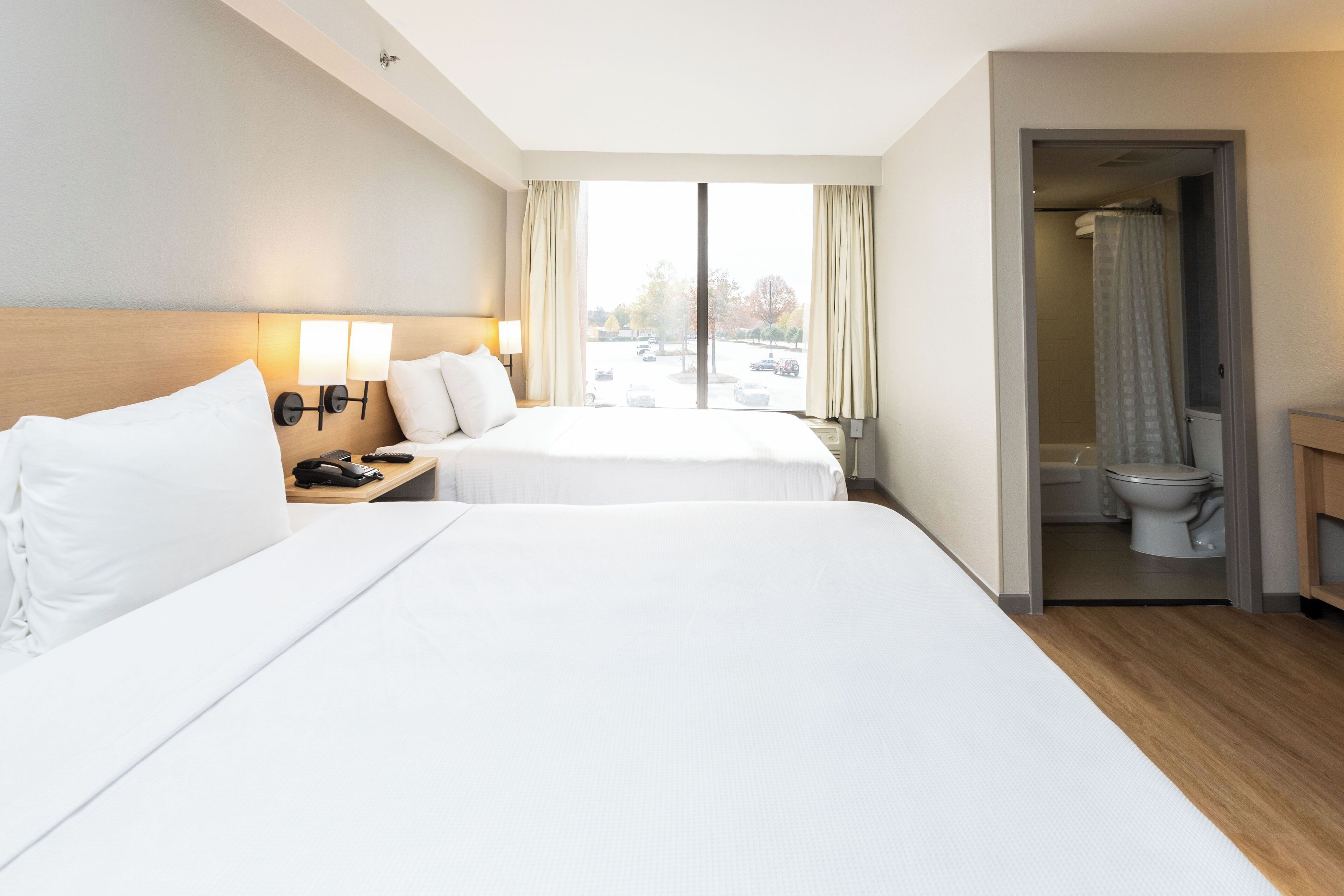 premium bedding, desk, blackout curtains, iron/ironing board