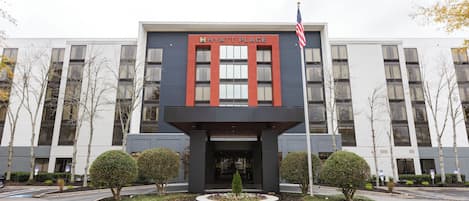 A modern building with a sign reading "Hyatt Place".