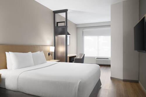 Premium bedding, desk, blackout drapes, iron/ironing board