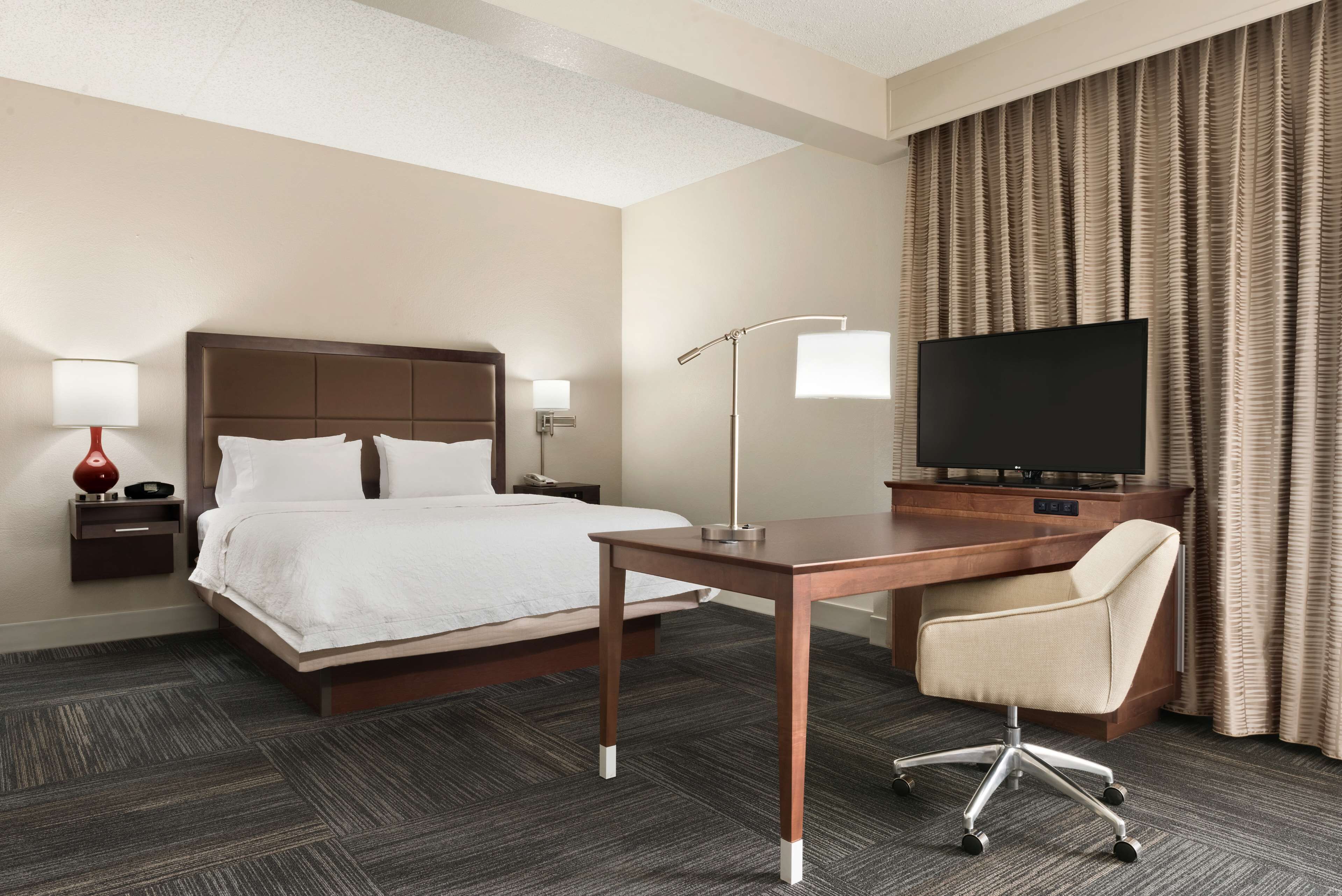 king studio suite | in-room safe, desk, laptop workspace, blackout curtains