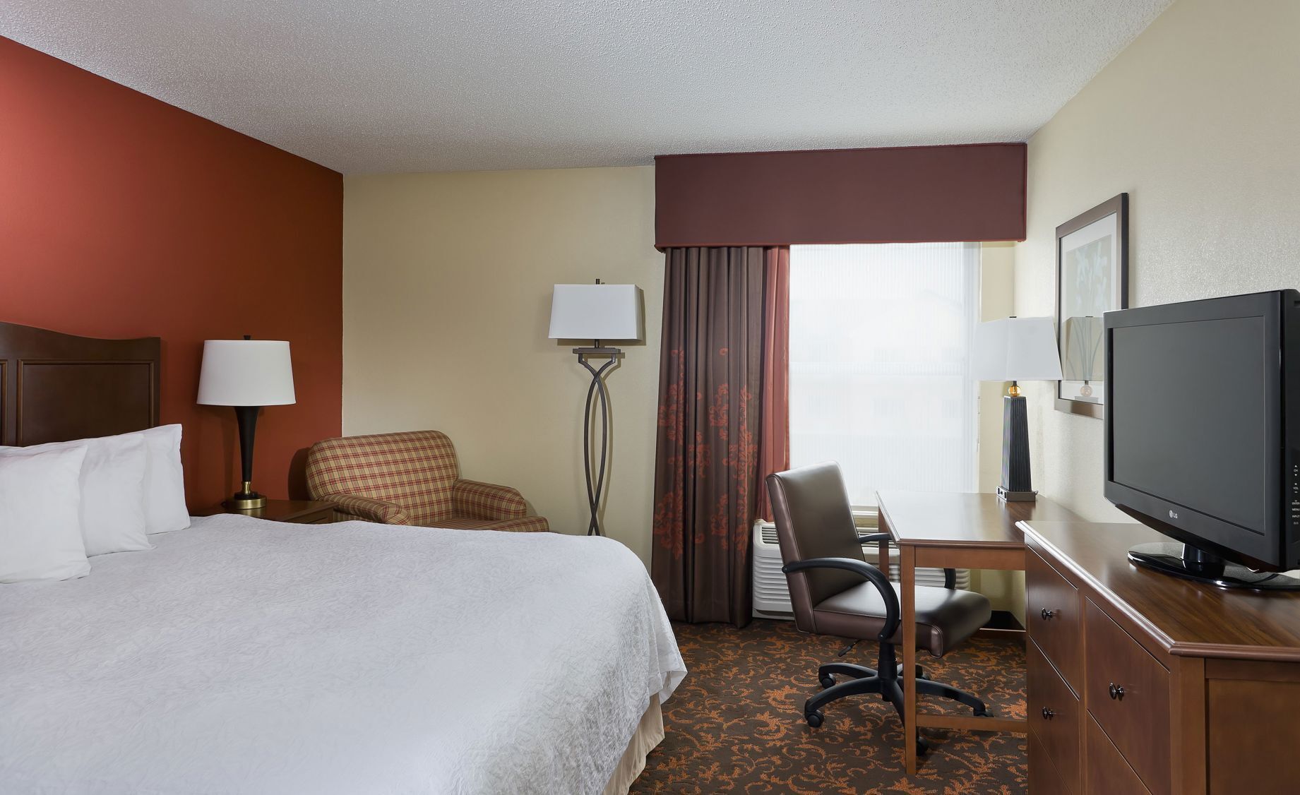 Hypo-allergenic bedding, laptop workspace, blackout curtains