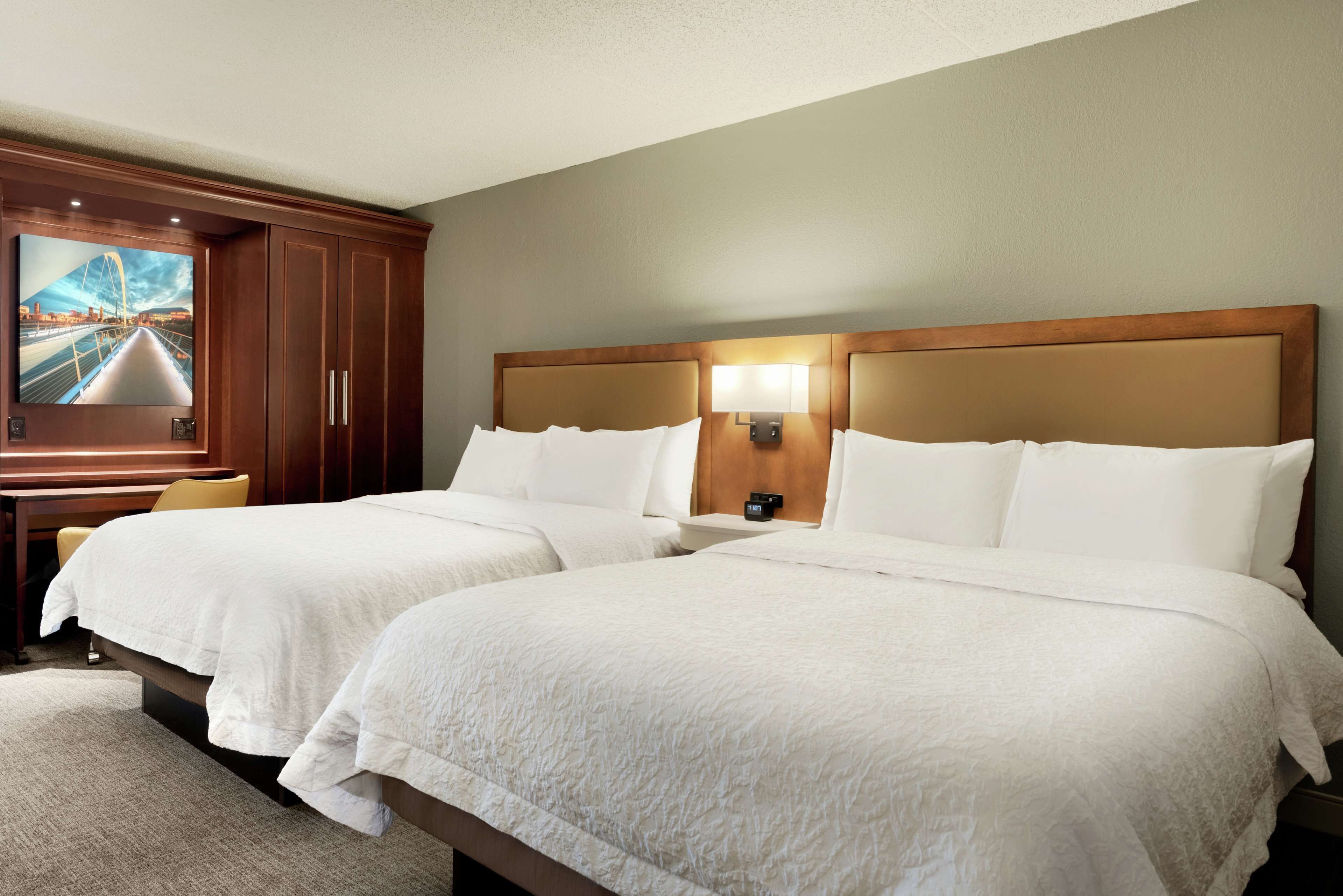 standard room with two queen beds | premium bedding, in-room safe, desk, laptop workspace