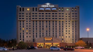 A large hotel with a prominent sign reading "CROWNE PLAZA" at the top.