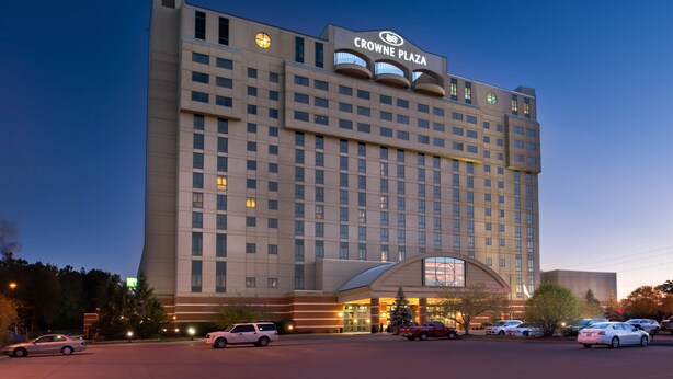 A large hotel with a prominent sign reading "CROWNE PLAZA".