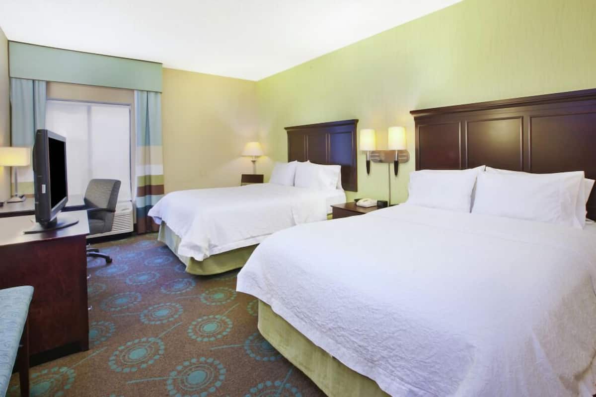 Premium bedding, pillow-top beds, desk, laptop workspace