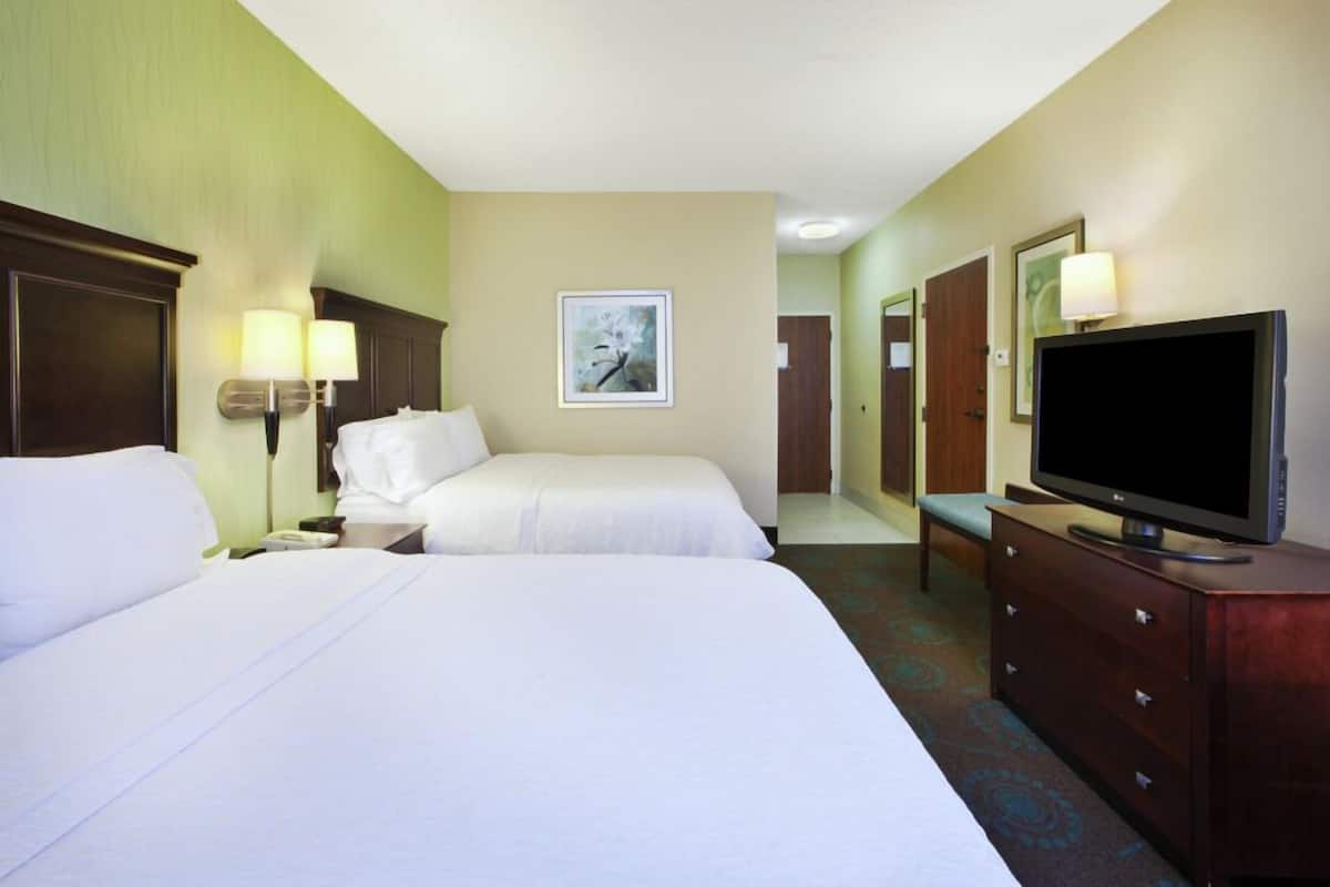Premium bedding, pillow-top beds, desk, laptop workspace