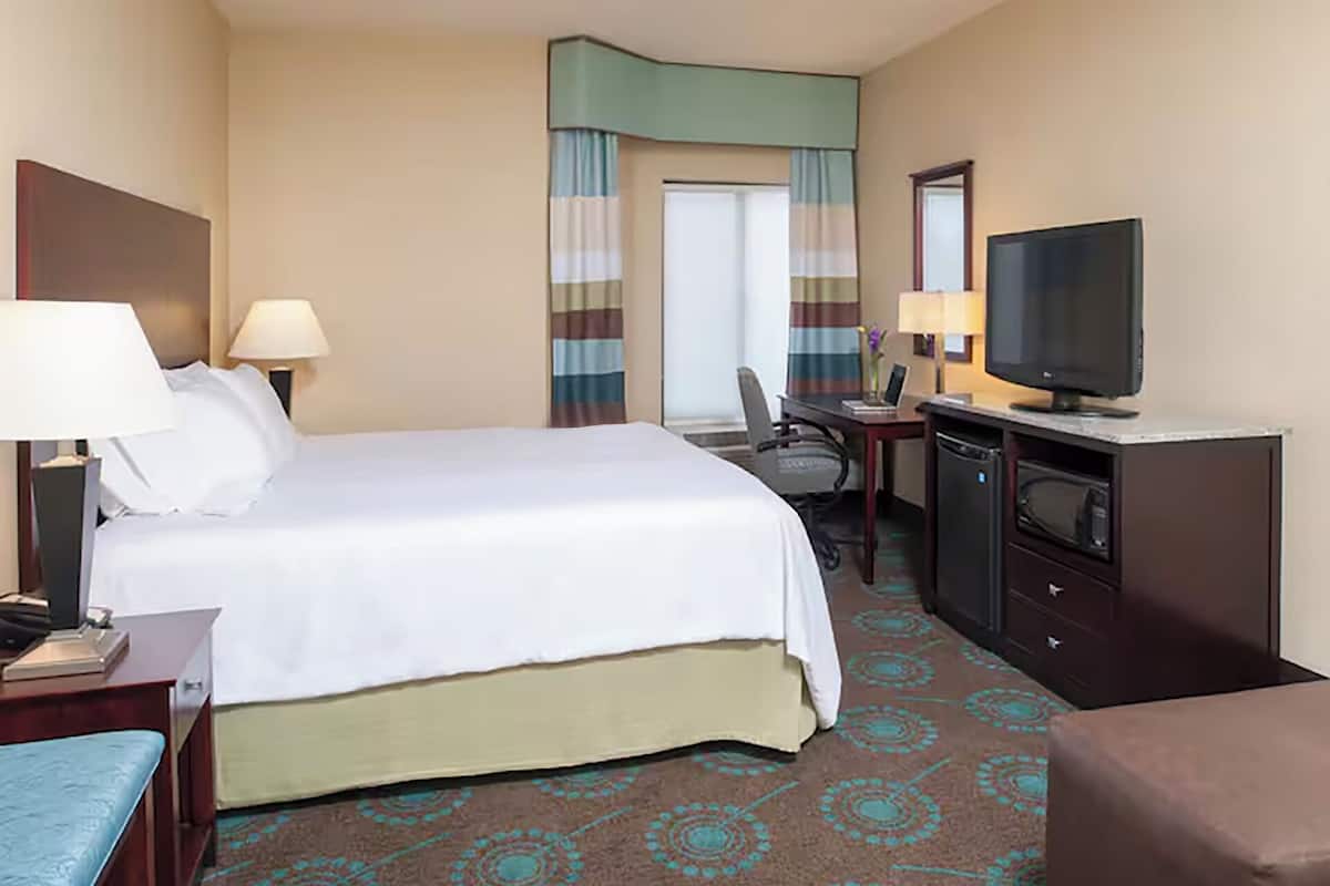Premium bedding, pillow-top beds, desk, laptop workspace