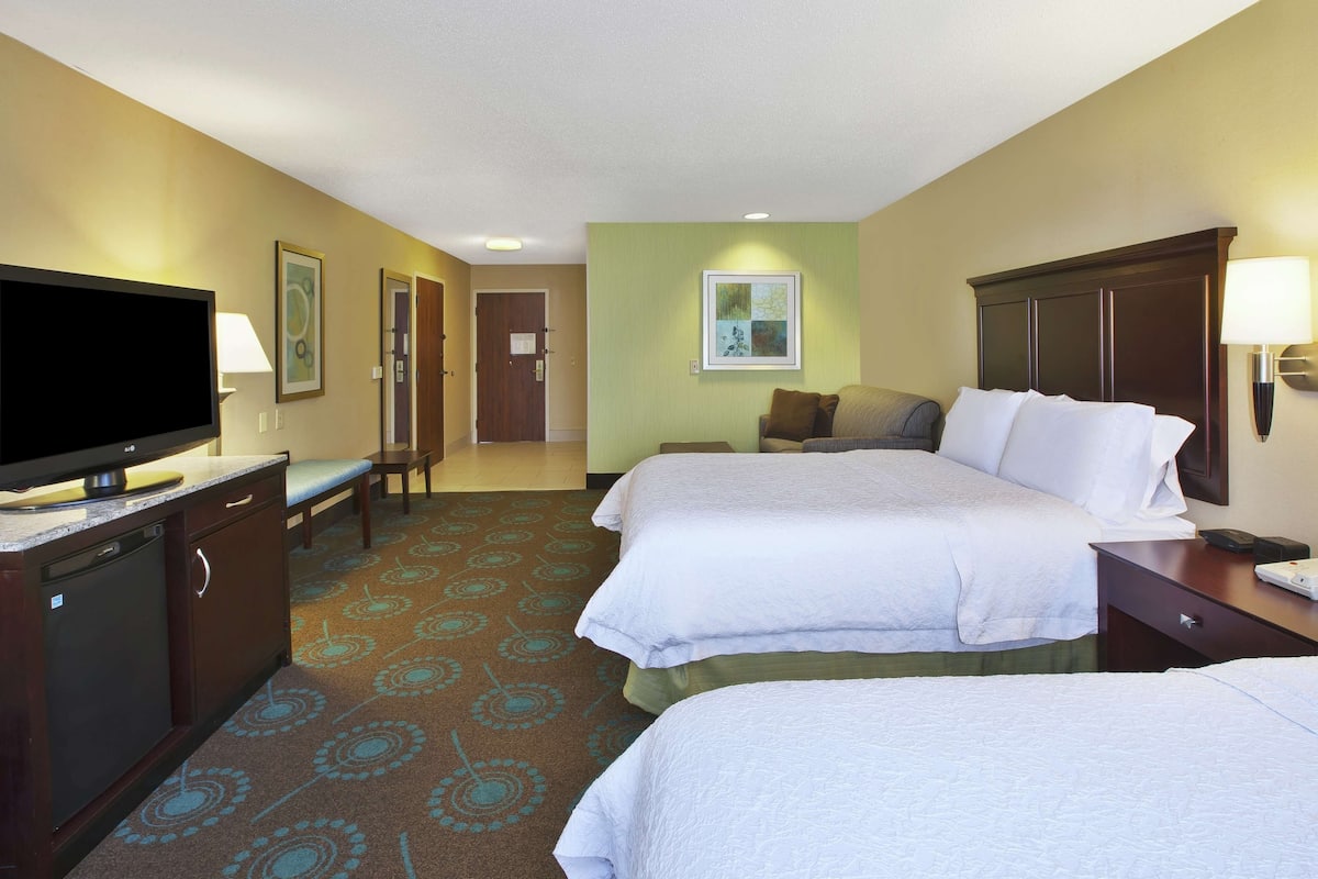 Premium bedding, pillow-top beds, desk, laptop workspace