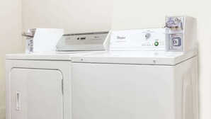 A front-loading Whirlpool washer and dryer unit with a control panel and a price tag on the dryer. - Days Inn by Wyndham Seymour (Seymour)