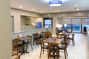 Enjoy meals in this stylish dining area with comfortable seating and a reception desk.
