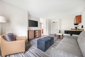 1 Bedroom King Suite | Living area | 55-inch TV with cable channels