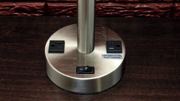 A metallic base with two power outlets and a switch, labeled '120V, 60Hz 7A MAX Total Combined'.