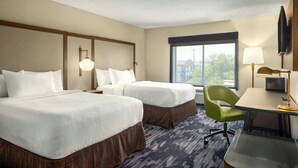 A hotel room with two beds, a desk, a chair, a TV, and a large window. - Fairfield Inn by Marriott Hattiesburg (Hattiesburg)