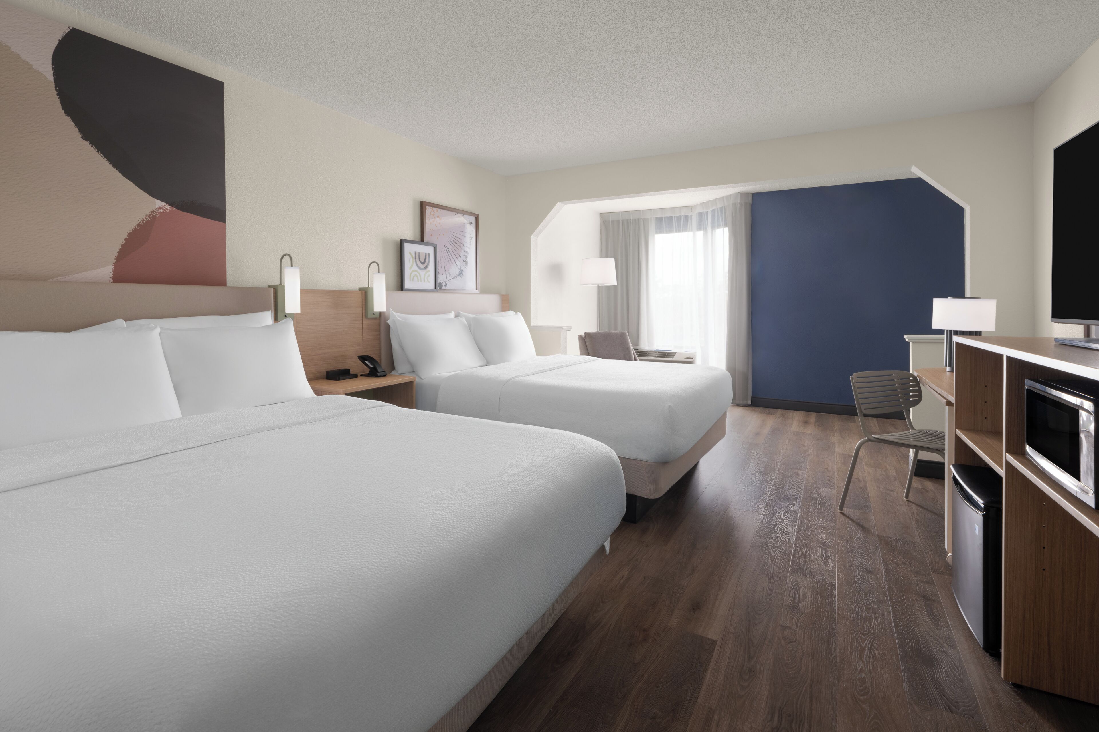 Room, 2 Queen Beds | Premium bedding, desk, iron/ironing board, free cots/infant beds