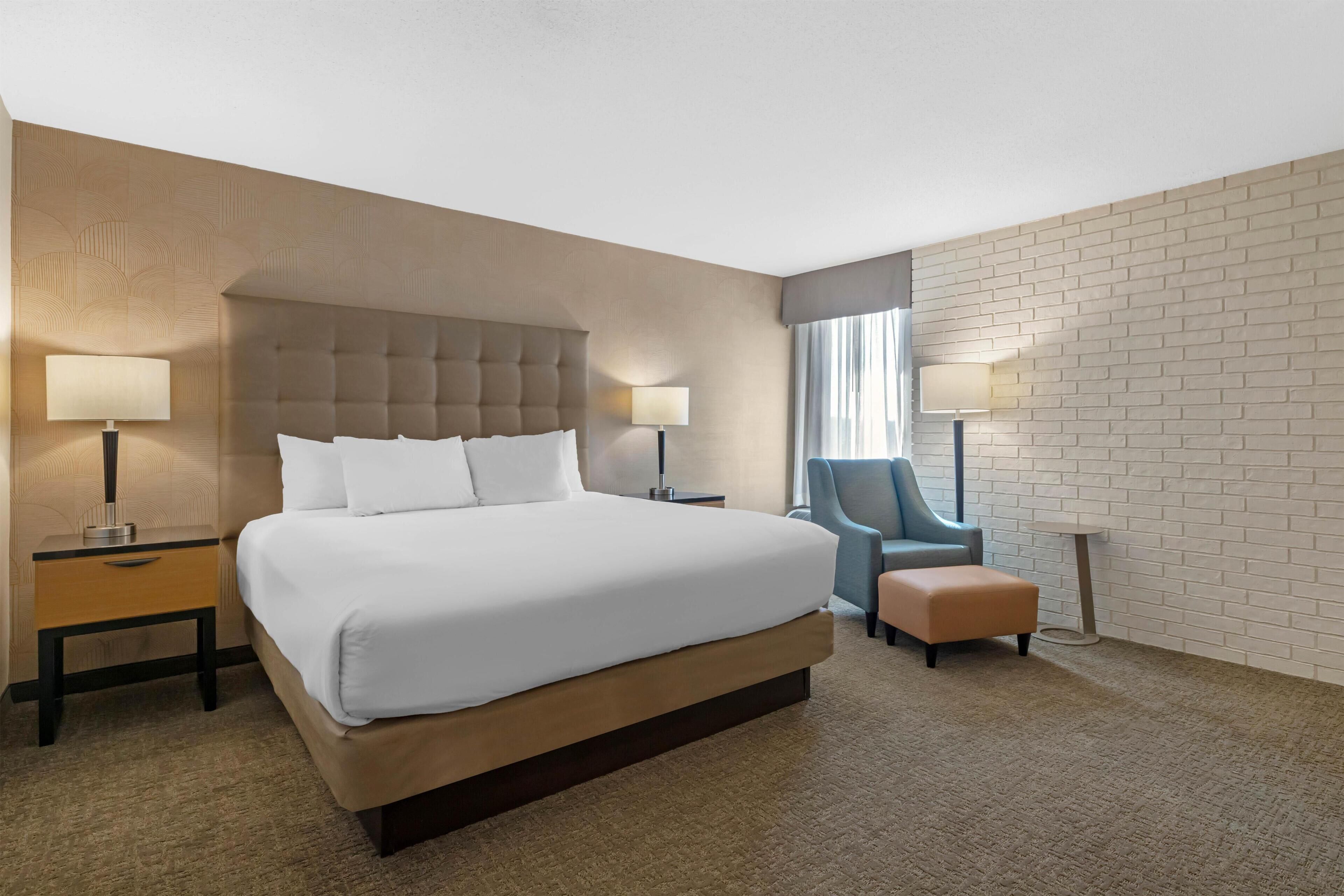 Desk, laptop workspace, blackout drapes, iron/ironing board