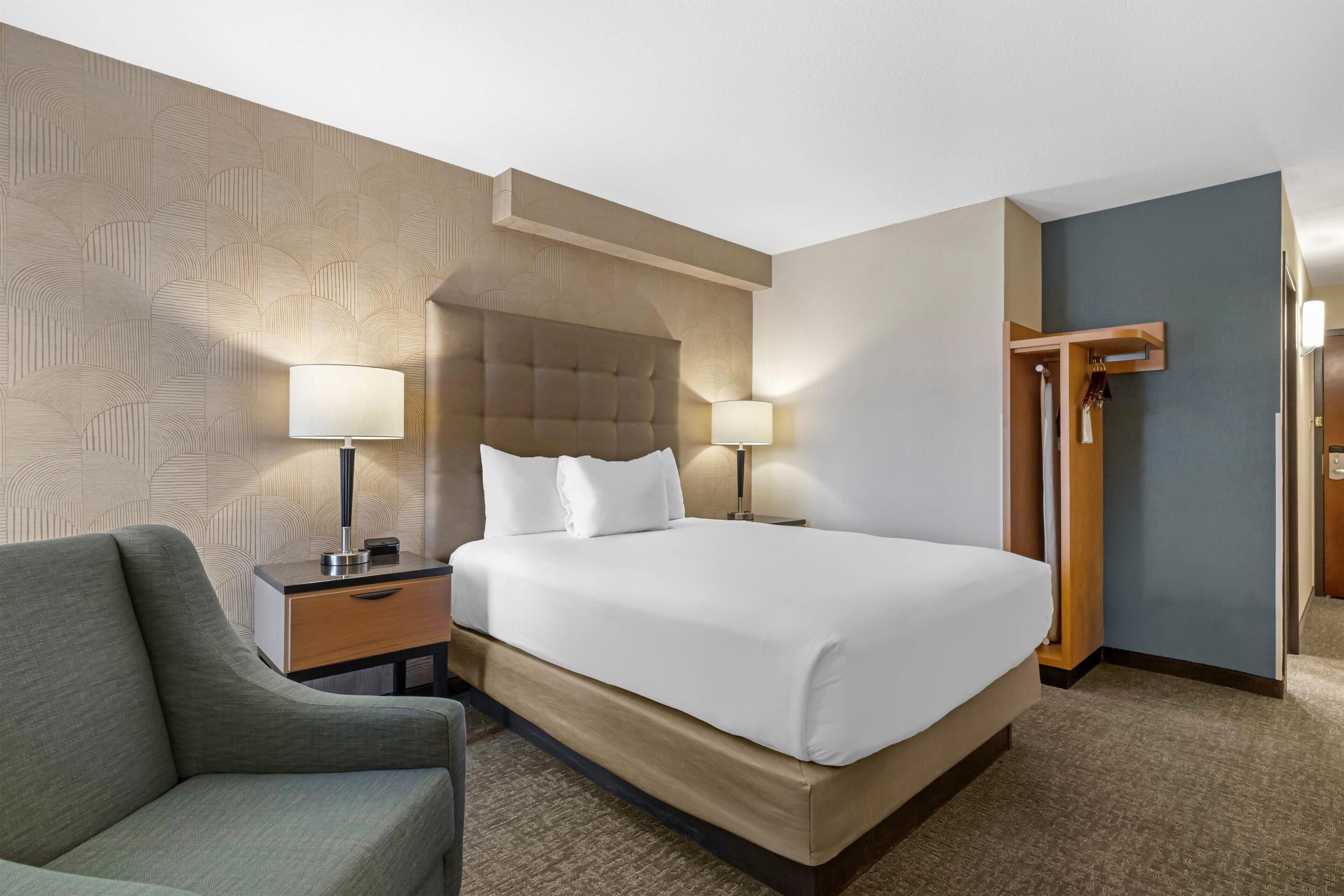 Desk, laptop workspace, blackout drapes, iron/ironing board