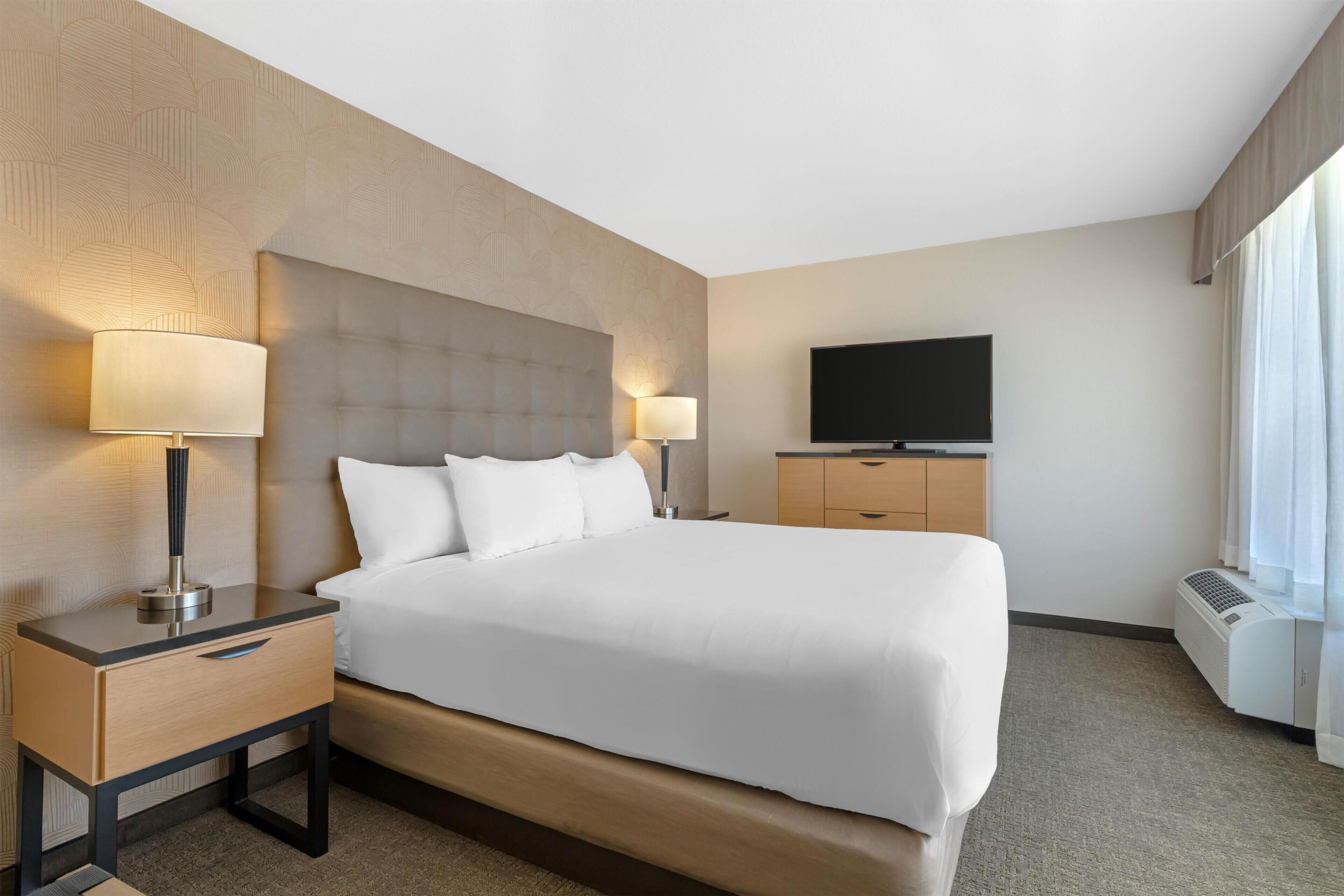 Desk, laptop workspace, blackout drapes, iron/ironing board