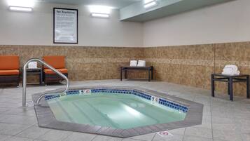 Relax by the pool, surrounded by a clean and functional space with seating areas and spa amenities available.