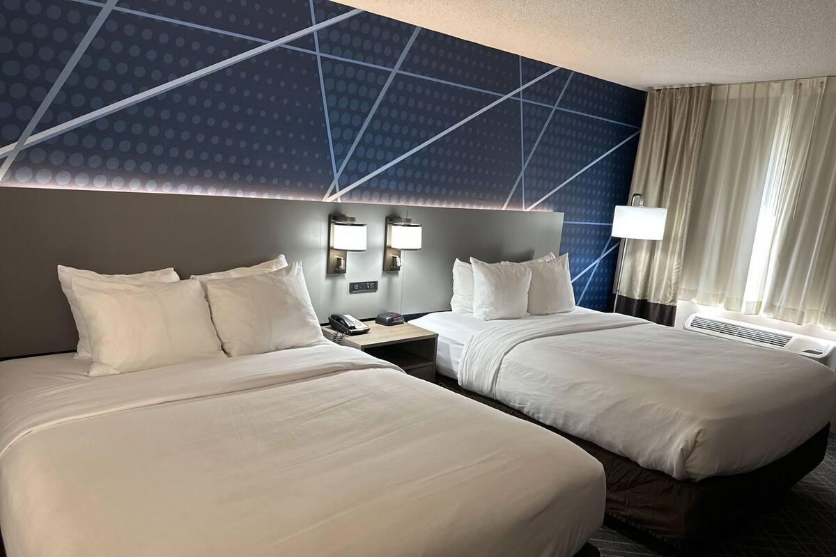 Premium bedding, desk, blackout drapes, iron/ironing board