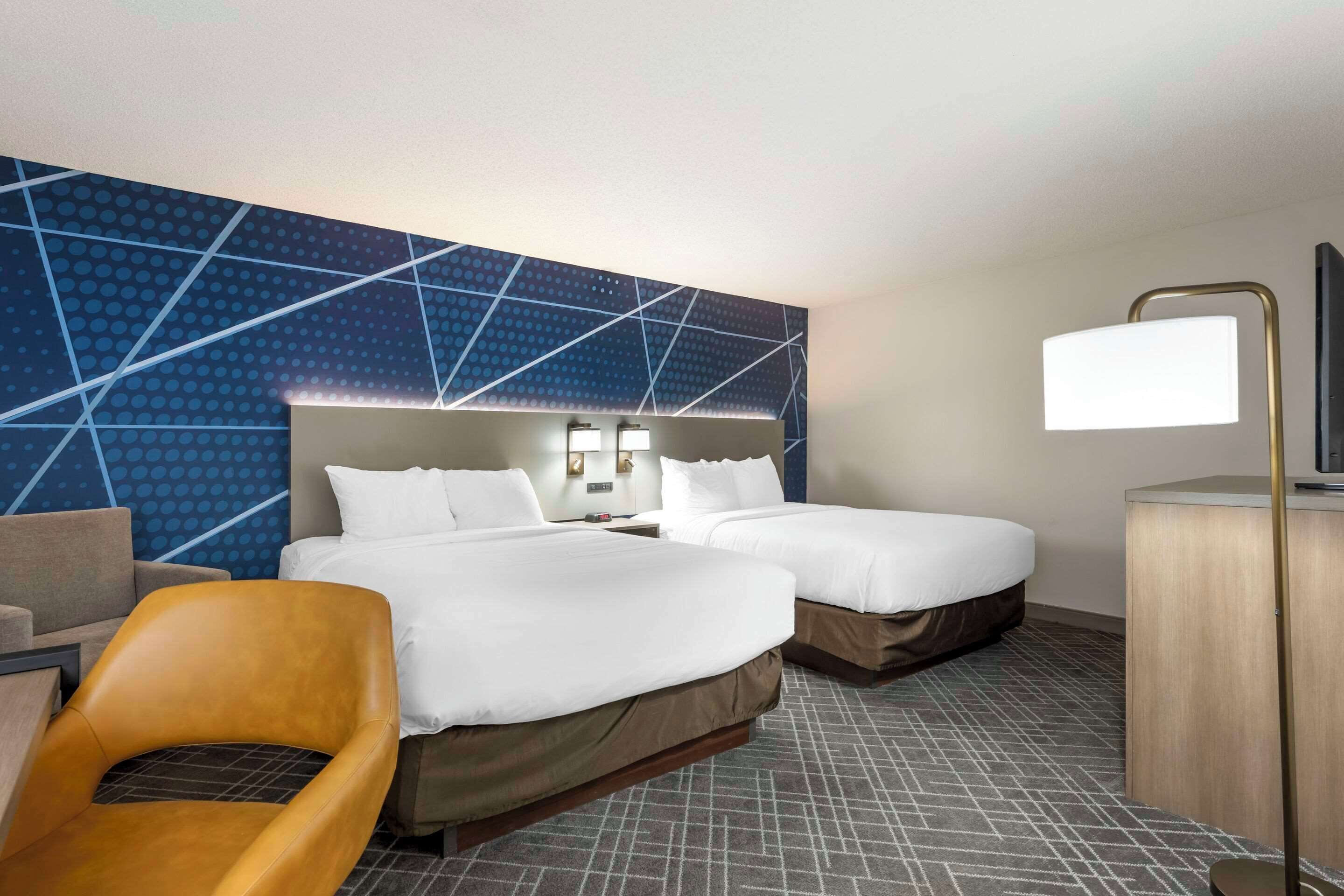 premium bedding, desk, blackout curtains, iron/ironing board