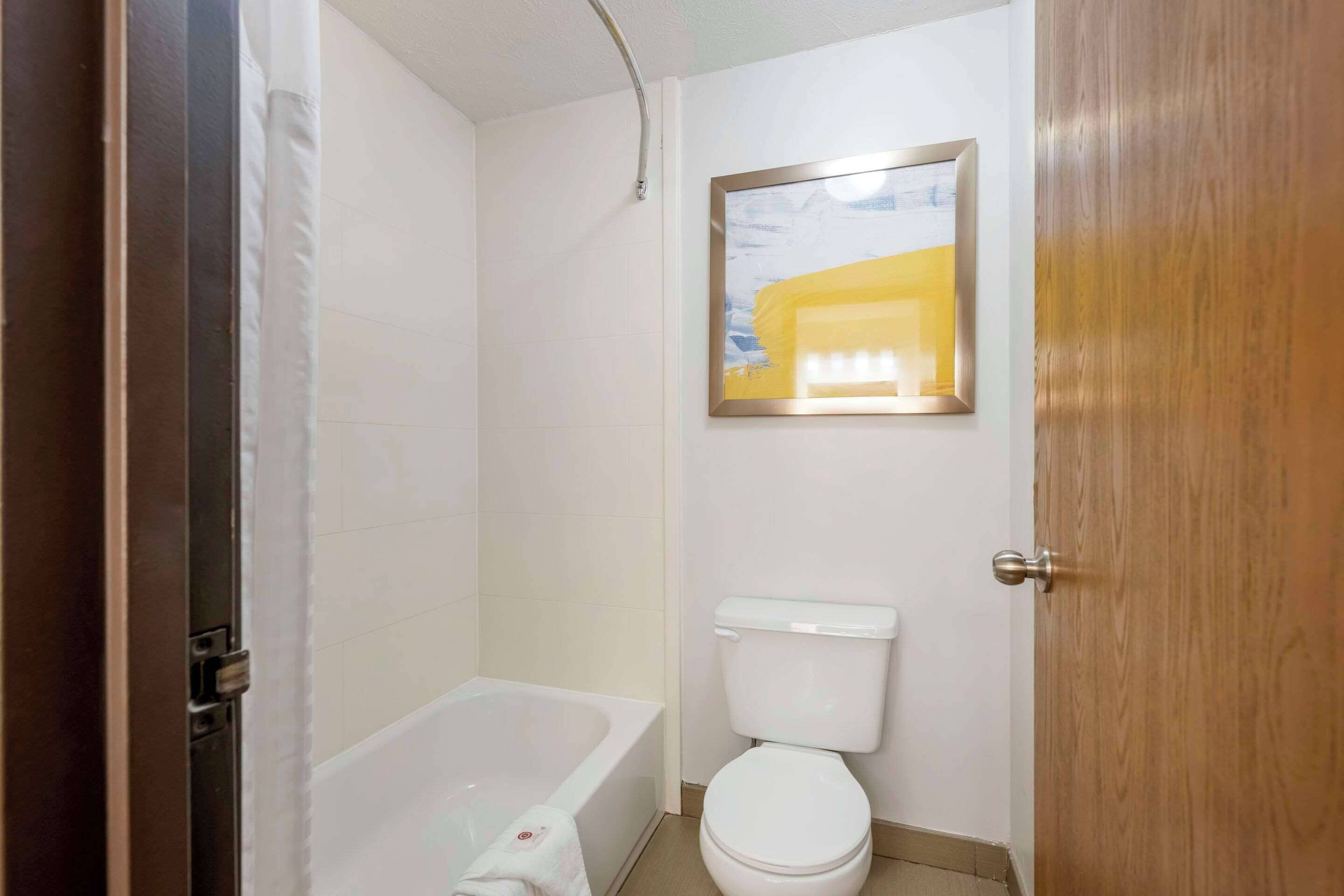 premium bedding, desk, blackout curtains, iron/ironing board