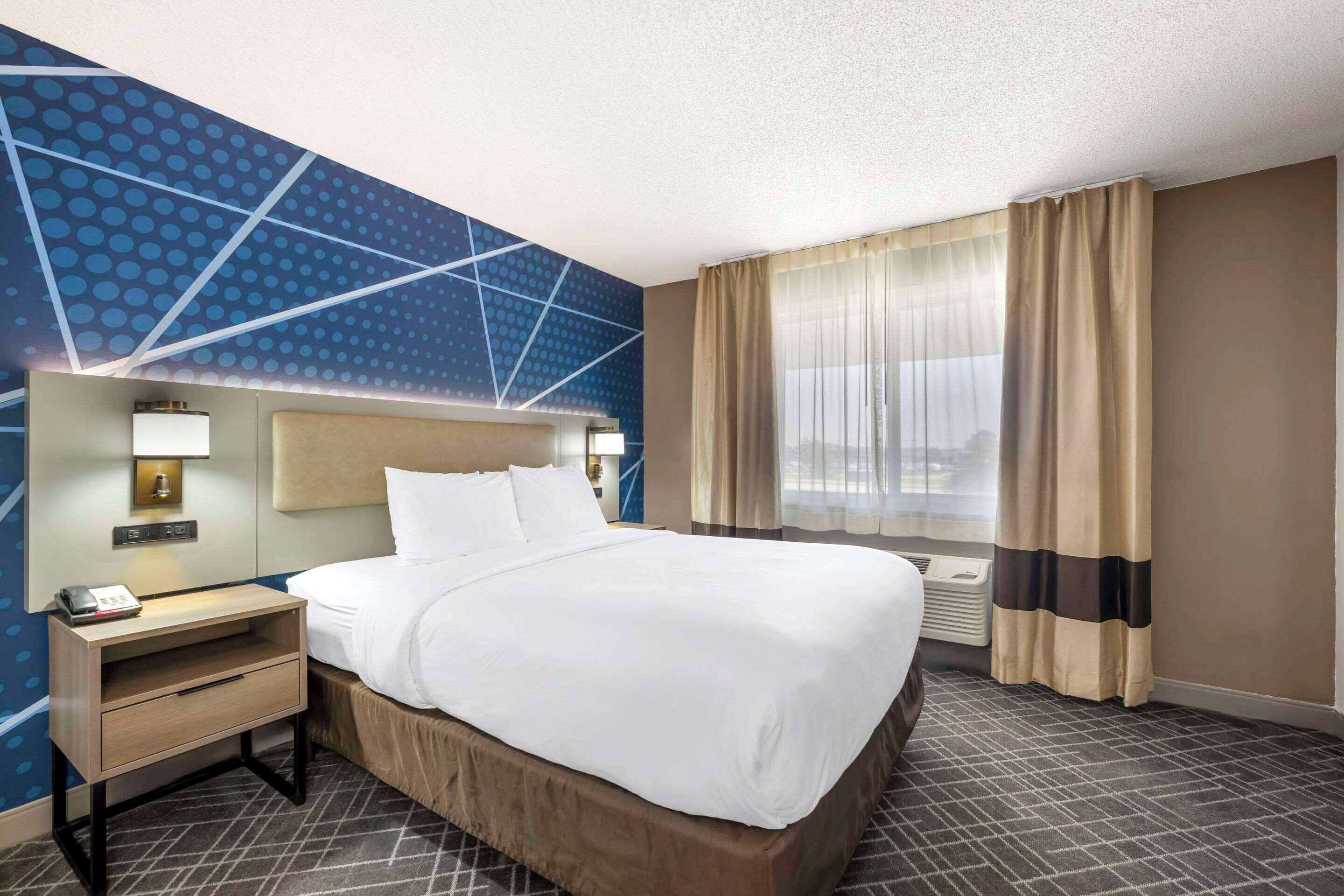 premium bedding, desk, blackout curtains, iron/ironing board