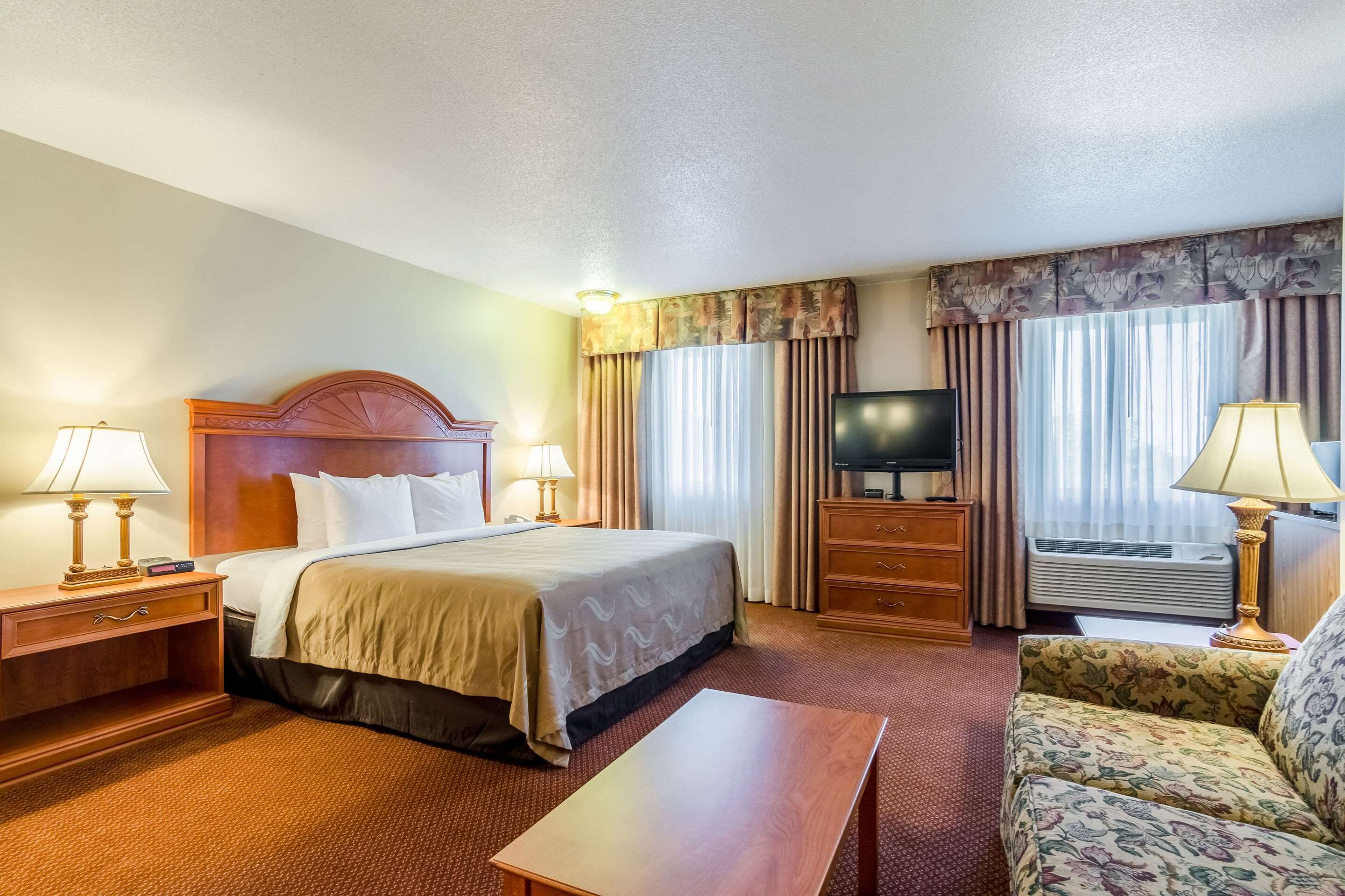 Desk, laptop workspace, blackout drapes, iron/ironing board