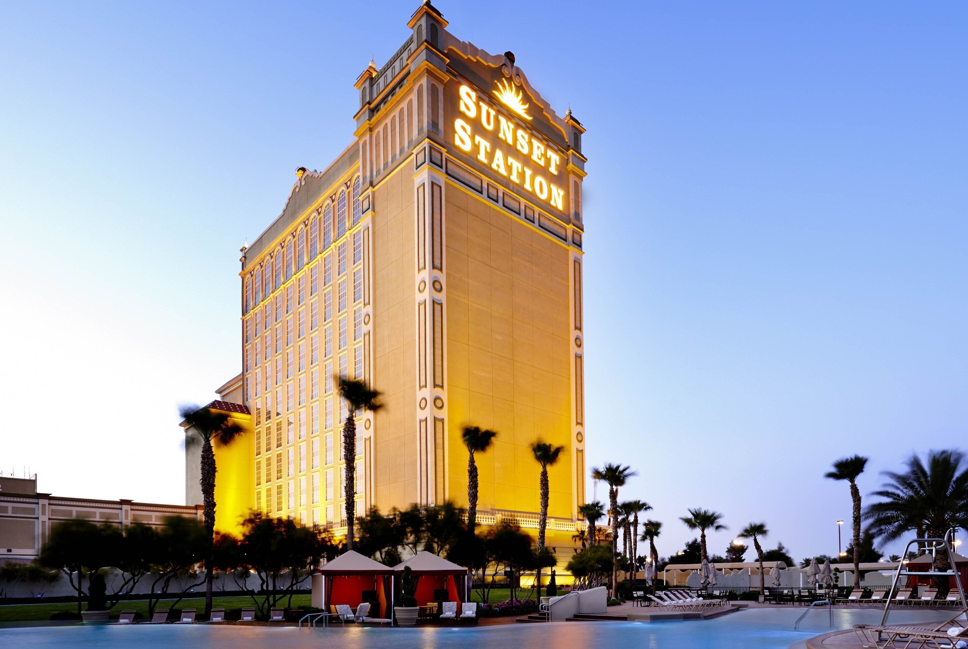 A large hotel with a prominent sign reading "Sunset Station."